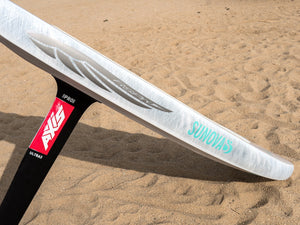 RSPro Fly SUP and Wing foil rail saver installed on a Sunova Foil SUP Downwind board laying on the beach