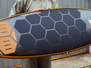 HexaTraction by RSPro black edition on a wood surfboard