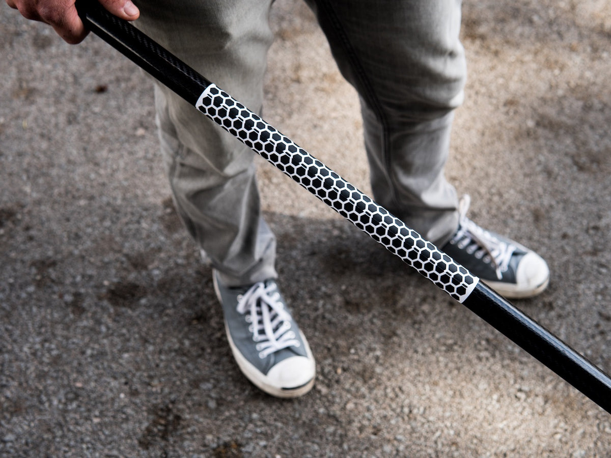 White RSPro Paddle Grip Hexa wrapped around a black paddle shaft, showing the length of the textured section