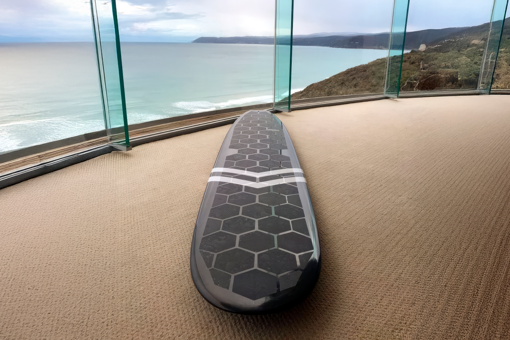 Longboard with clear RSPro HexaTraction near a glass-walled room with ocean view