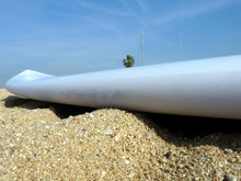 Load image into Gallery viewer, Surfboard laying on beach sand with Surf RSPro rail protection
